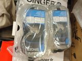 two mp3 players sitting on top of a cardboard box