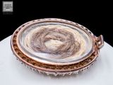 a picture of a close up of a piece of hair on a plate