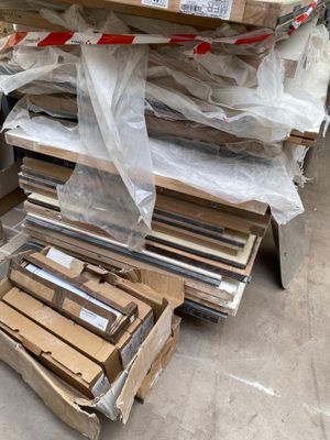 a pile of boxes that are sitting on the ground