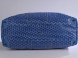 an image of a blue handbag on a white surface