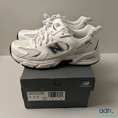brand new balance shoes in box on table with white background