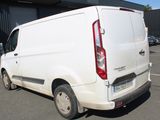 a white van that is parked in a parking lot