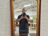 a man taking a picture of himself in a mirror