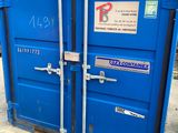 a blue container that is sitting on the ground