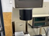 a machine that is making doughnuts on a table