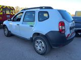 the back of a white dacia parked in a parking lot