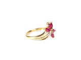 an image of a gold ring with pink stones on it