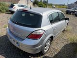 a silver car that is parked in a lot