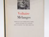 the book cover of voltaire melanges, with an image of a woman ' s face on it