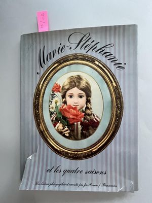 a book with a picture of a young girl in a picture frame