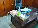 a desk with a chair and a book on it