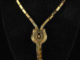 a close up of a necklace on a mannequin neck