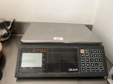 an image of a digital scale sitting on top of a kitchen counter