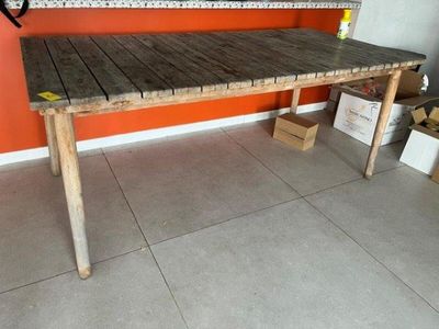 a wooden table that is sitting in the middle of a room