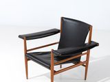 an image of a black leather chair on a white background