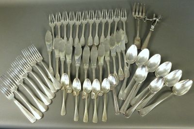 a lot of silver spoons and forks on the table