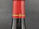 a bottle of wine that is sitting on a table