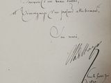 a handwritten letter that is on a piece of paper