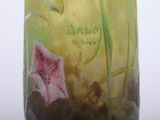 a glass vase with a painting of flowers on it