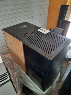 a black microwave sitting on top of a wooden cabinet