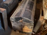 several pieces of luggage are stacked on top of each other in a room