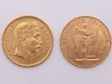 two gold sovereigns, one of which is a woman and one of which is a man