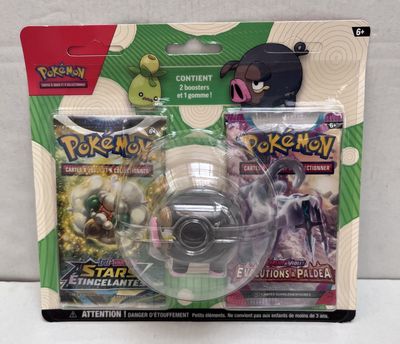 a pokemon figure and a toy in a package
