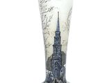 a tall glass with a picture of a church on it