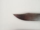 a knife on the table next to a knife on the table
