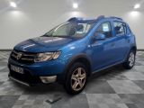 the blue dacia is parked in a room with a checkered floor