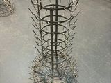 a large metal rack with a bunch of forks inside of it