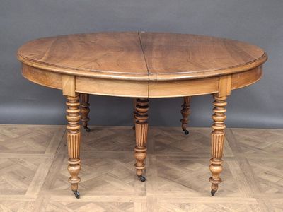 a wooden table with two legs and a round top