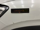 a close up of a sticker on the hood of a car