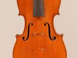 an old violin with a bow hanging from it ' s back