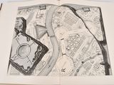 an open book with a drawing of a map on it