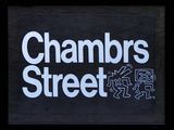 a sign that says chambers street on the side of a building