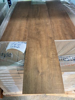 many boxes of wood on a pallet in a warehouse