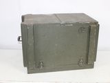 an old metal box sitting on top of a table