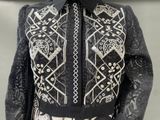 an image of a woman wearing a black and white jacket