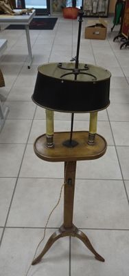 a lamp that is sitting on a stand in a room