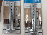 two pairs of saw blades are sitting on a table next to a pair of saw blades