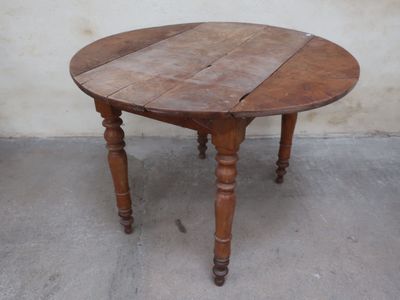 a wooden table that has been turned into a dining table
