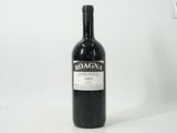 a bottle of wine that is sitting on a table