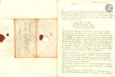 an old document with a piece of paper on top of it and a piece of paper on the bottom of it
