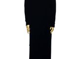 a mannequin dressed in a black dress on a stand