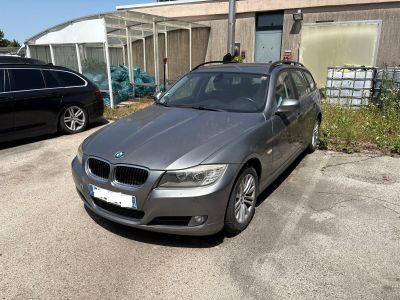 a silver car parked in front of a building