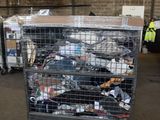a metal cart filled with lots of trash in a warehouse