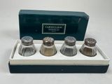 three salt and pepper shakers in a box