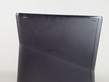 laptop computer sitting on top of a white surface with a white background