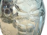 a clear glass vase with a white flower inside of it
